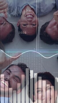 Vertical video: 8 adults lying, HUD appearing, charts animating, raising thumbs up celebrating biz