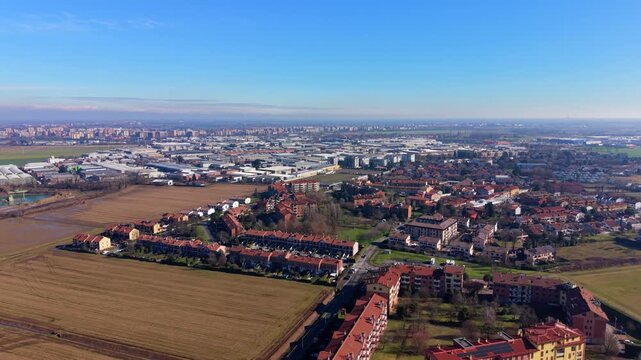 Drone flying above suburban town and countryside
