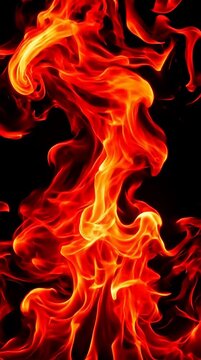Vibrant flames dancing upwards in a dynamic close-up against a dark background