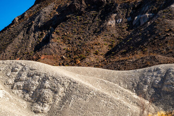 Ripples Of Tuff Layer Stand Out Against The Volcanic Layer Above