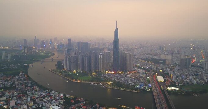 Aerial view of Ho Chi Minh City skyline and skyscrapers in center of heart business at Ho Chi Minh City downtown. Financial and business centers in developed Vietnam. Sunset to night.