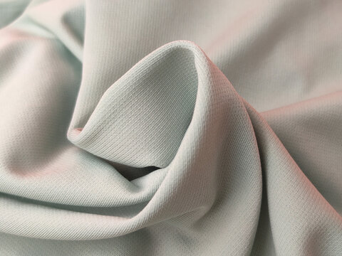 This appears to be a&nbsp;mint green ribbed knit fabric, likely made from a blend that includes&nbsp;polyester, cotton, or spandex