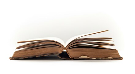 Fototapeta premium An open book with pages turned to the right, revealing a blank page.