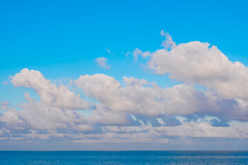 Nature clear sky and summer sea water for summer vacation concept.with sunlight of beautiful clouds blue sky with white altocumulus clouds.with	
