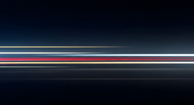 Dynamic long exposure light trails creating an abstract blur of rapid motion against a dark background, symbolizing speed, technology, and energetic movement