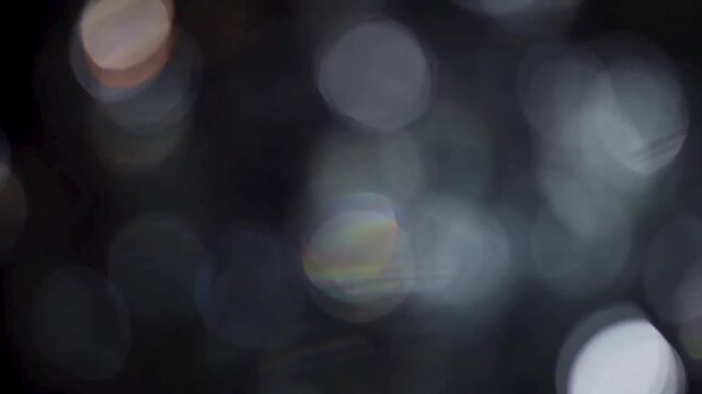Smooth Floating White and Gray Bokeh Lights Cinematic Background Loopable Animation.