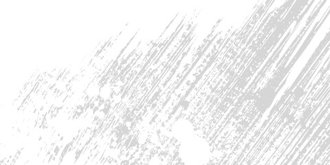 Obraz premium Abstract background with diagonal gray brush strokes and scattered dark particles on a white surface.