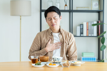 体調不良なミドルの男性