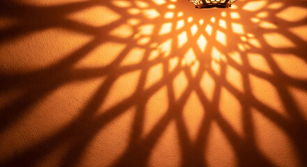 Warm geometric shadow pattern cast by traditional lantern light