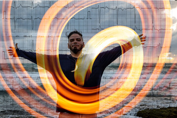 Adult male with arms outstretched on beach expressing relief and resilience over ECG background