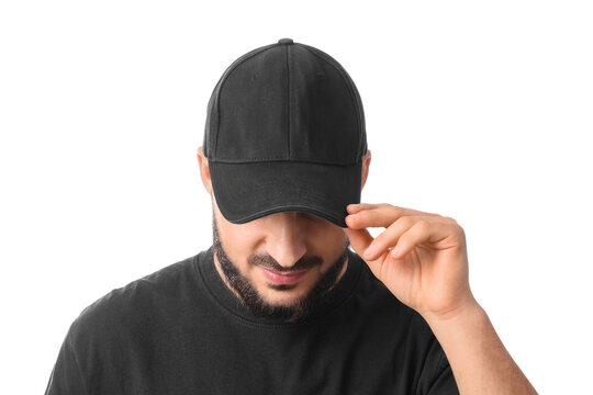 Handsome young man in stylish cap on white background