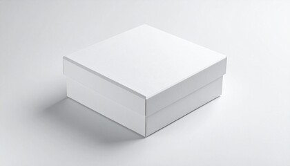 Fototapeta premium Clean white square box with a lid on a light background, perfect for product packaging mockup.