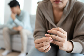 Divorce. Wife remove married ring and sign Divorce form. Couples desperate and disappointed after marriage. wife sad, upset and frustrated after quarrels conflict. distrust, love problems