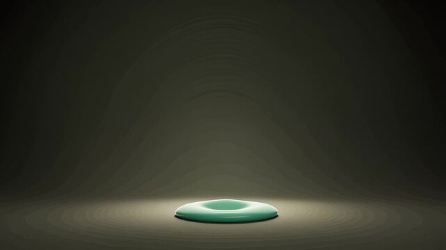 Teal Silicone Butt Plug On Dark Background With Spotlight