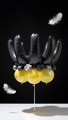 Creative Balloon Arrangement Featuring Black and Yellow Balloons with Floating Feathers on Dark Background