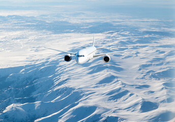An airplane flying over a taurus mountain range, with snow-capped peaks visible below