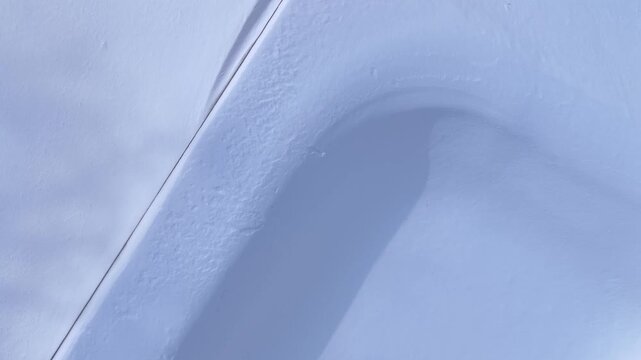 Outdoor public park in Winter time after deep snow fall from freezing cold front in central New York State village of Fairport