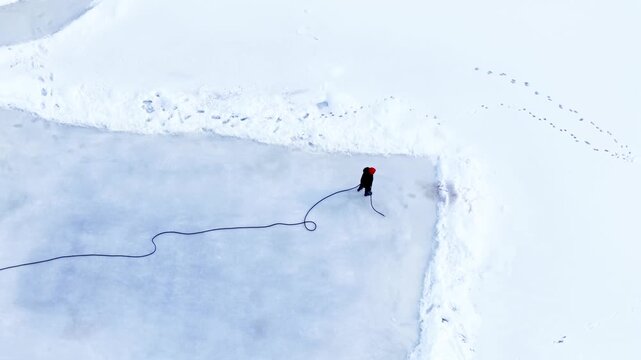Outdoor public park in Winter time after deep snow fall from freezing cold front in central New York State village of Fairport