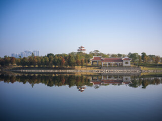 Fototapeta premium Lakeside Scenery and Architectural Reflections at Maluan Bay Park, Xiamen, Fujian