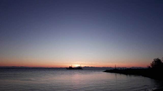 Subset in background with the dredger working along the shoreline