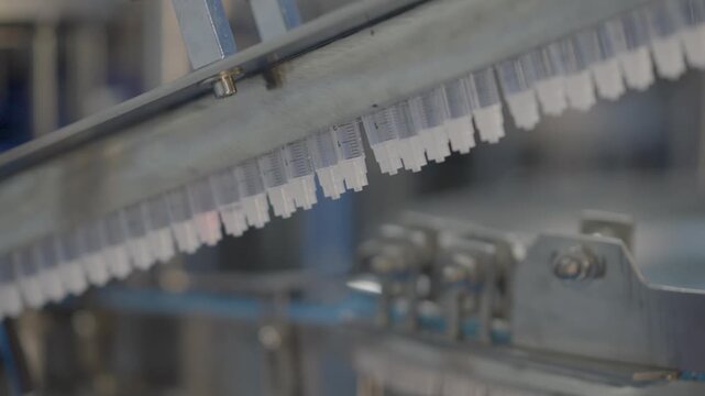 Medical Syringes Moving On A Conveyor Machine During The Manufacturing And Assembly Process.