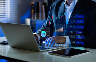 Businessman using laptop analyze investment in stock market.