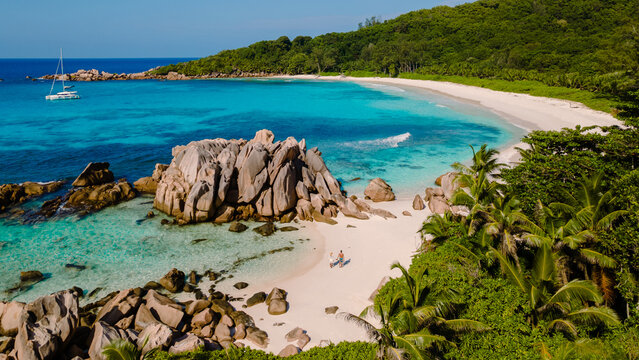 Discover tranquility at Anse Cocos beach in La Digue, Seychelles during a sunlit escape