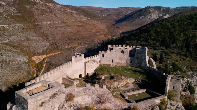Stjepan Grad Castle Fortress in Blagaj, Bosnia - 4K aerial drone view during Golden Hour