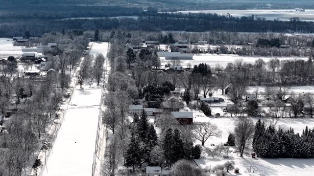 Route 9 in Hadley town commons, aerial establishing in winter with snow and ice