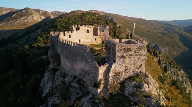 Stjepan Grad Castle Fortress in Blagaj, Bosnia - 4K aerial drone view during Golden Hour