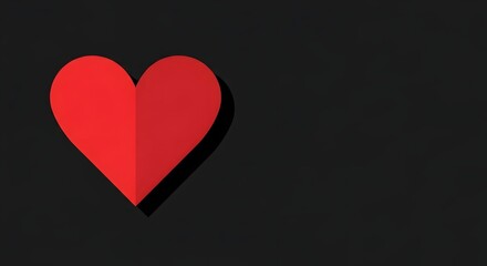 Obraz premium A red heart symbol casting a shadow on a dark background viewed from the front