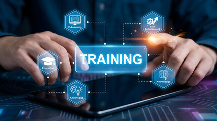 Hands interacting with a glowing virtual screen displaying TRAINING and icons for E Learning Skill Enhancement Education and Knowledge