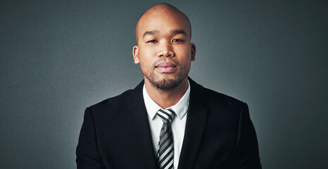 Serious, business and black man with portrait in studio for corporate career, ambition and...