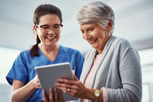 Happy, tablet and nurse with senior woman in clinic for online results, diagnosis and consulting. Laugh, hospital and person with elderly patient on tech for report, medical service and healthcare