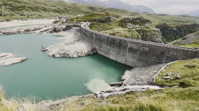 Montespluga Lake dam and alpine waterfall - 2022 drought in Italian Alps