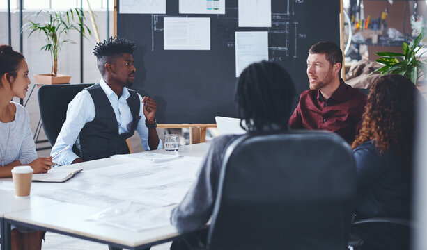 Creative, meeting and people with laptop, teamwork or blueprint for property development and talking. Architecture, group and urban planning with tech for real estate, design and ideas for project