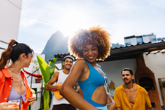Group of friends enjoying a roda de samba in Rio de Janeiro outdoors