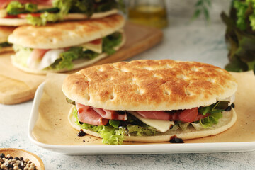 Panini sandwich with prosciutto in Italian style	