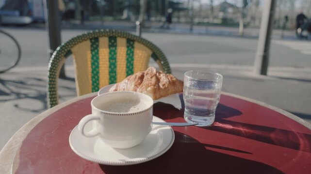 Close-up of Breakfast Set on a Red Bistro Table in the City