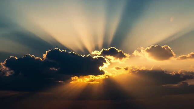 A breathtaking display of nature's beauty unfolds as majestic sun rays burst dramatically through a canopy of dark, fluffy clouds. The sky transitions from vibrant golden and orange hues at the horizo
