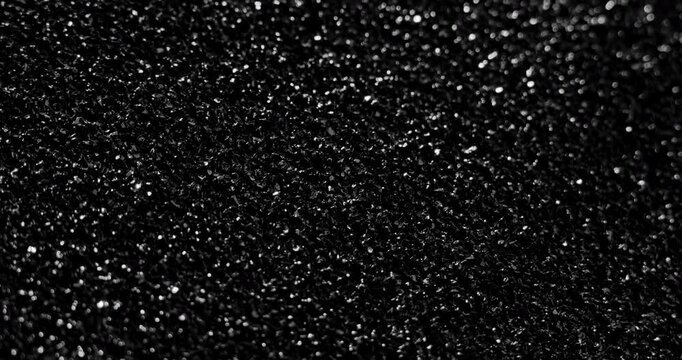 Black grunge background. Сlose-up. A high-resolution dark texture background captured in smooth motion. 
