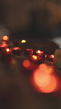 Red blurry light from small candles - bokeh effect