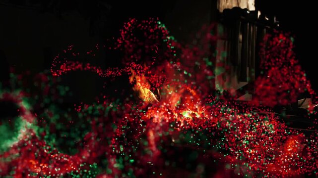 Converging particle cloud sparking flame, forming ribbons and emitting sparks to reveal support