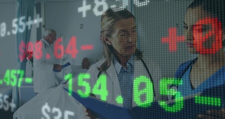 Consulting, Dr in white coat, nurse in blue scrubs with clipboard, stethoscope in ward, ticker