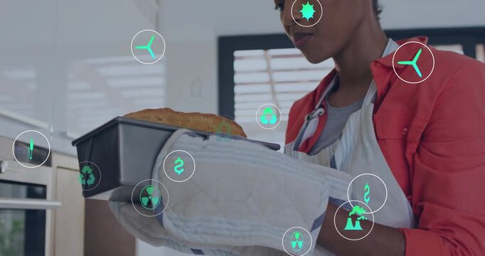 Baker pulling pan from oven checking doneness inspecting golden top green icons floating over frame
