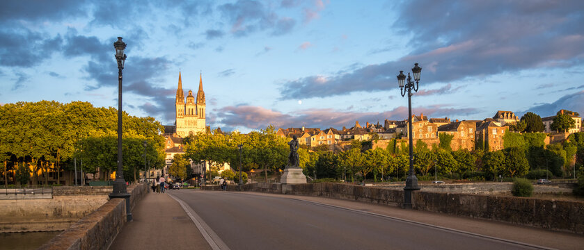 Sunset scenery in beautiful city of Angers in France, with famous chateau and cathedral