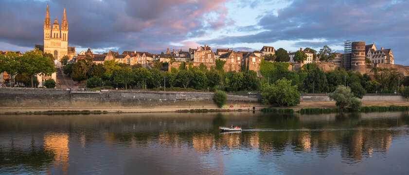 Sunset scenery in beautiful city of Angers in France, with famous chateau and cathedral