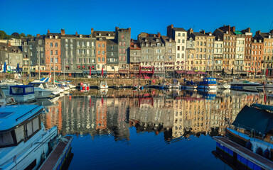 Fototapeta premium Sunset scenery in beautiful town of Honfleur in France with a little harbor 