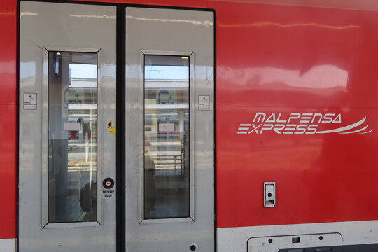 Marpensa Express red train at the Milano Porta Garibaldi Station in Milan, Italy. May 21, 2025