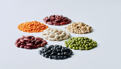 Obraz premium Colorful assortment of beans and pulses arranged in bowls.